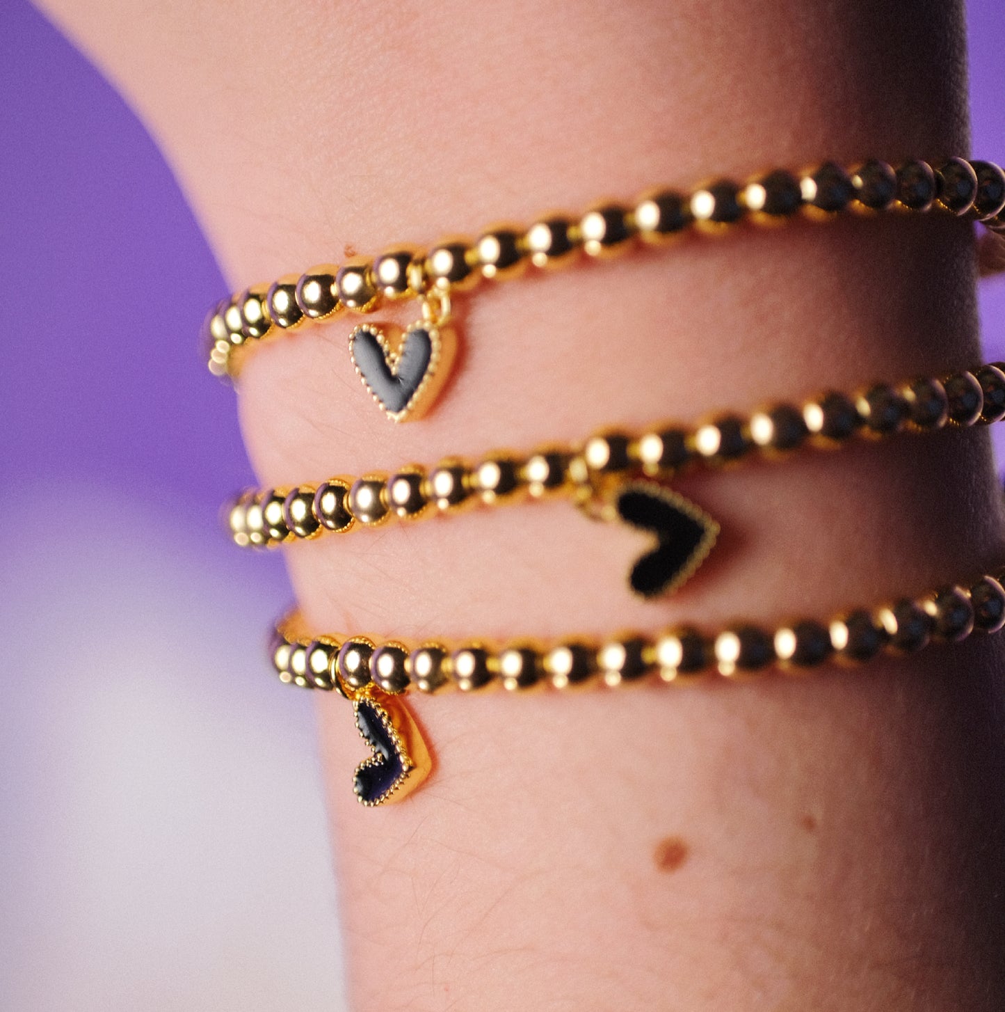 Gold beaded and black dangle heart adjustable Bracelet